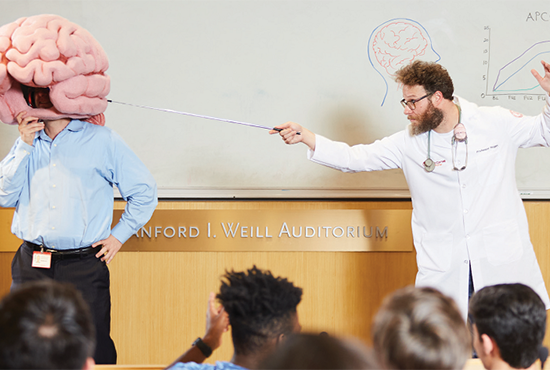 Two men in a lecture hall.
