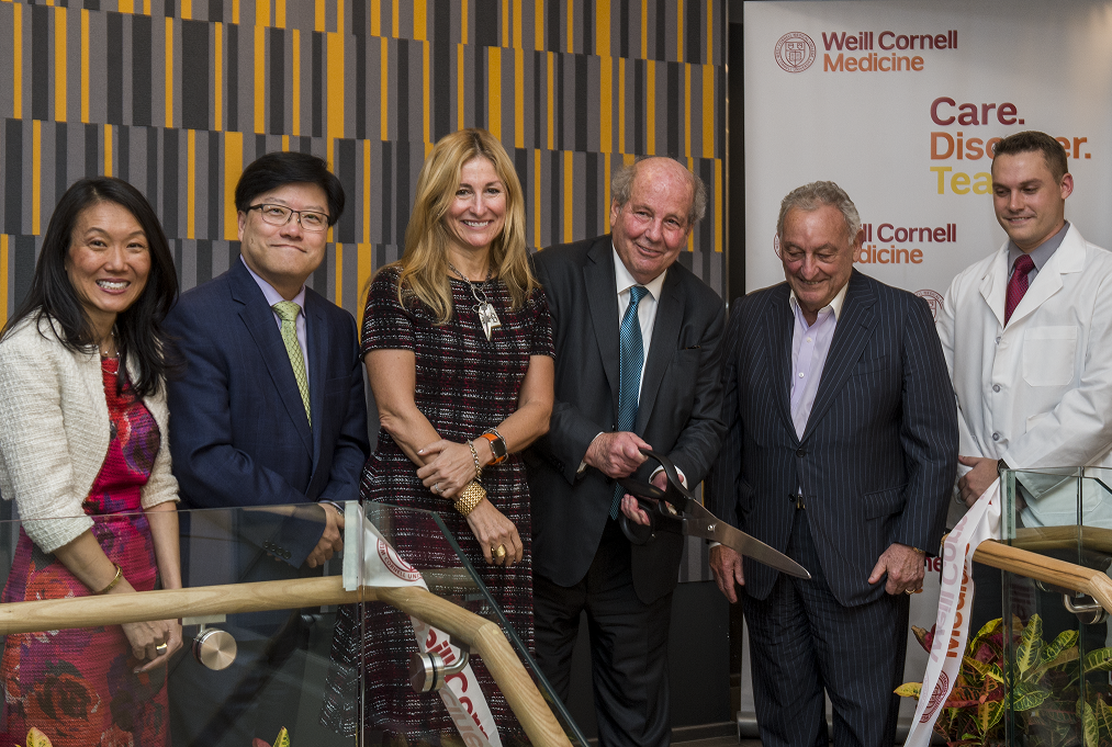  Weill Cornell Medicine leaders gather for a ribbon cutting to officially open the Feil Family Student Center