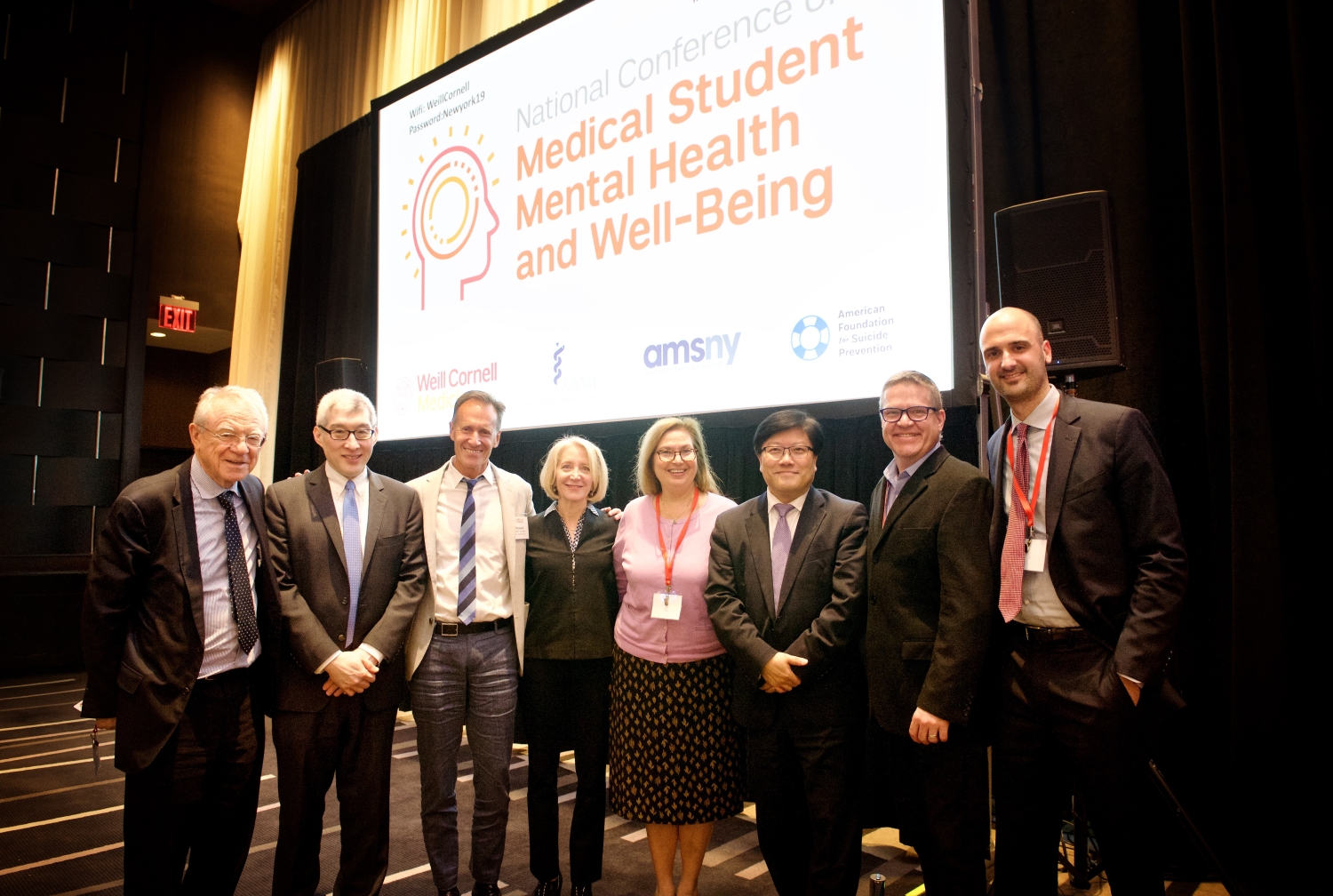 A group pose at a conference