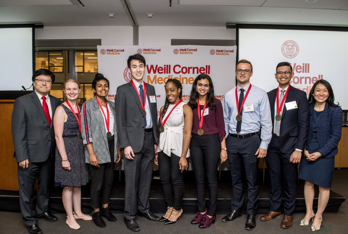 Students receive their Siegel Family Student Prizes April 29 during the Salute to Scholarship10th Anniversary ceremony. From left: Dr. Augustine M.K. Choi, Eliza Gentzler ’19, Shobana Ramasamy ’19, Paul Paik ’20, Amber Hamilton ’22, Priyanka Narayan ’22, Sven Walderich ’20, Joel Jose Nario ’21, John Chae ’21(not pictured) and Dr. Yoon Kang. Credit: Studio Brooke