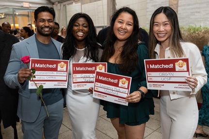 Group of people pose for a photo during an event