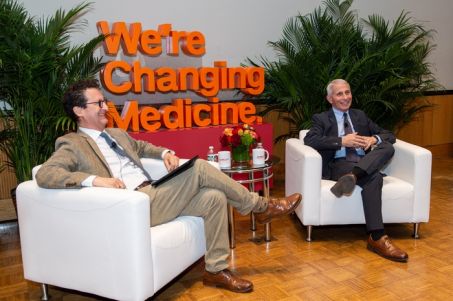 a man interviewing an established professional during a Q&amp;A event at a medical university